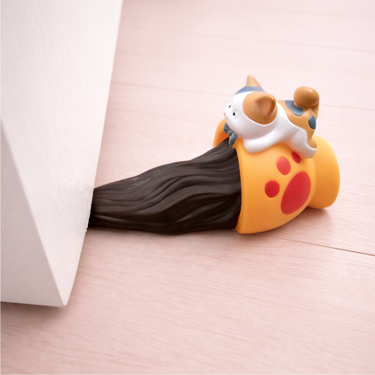 Cute cat door stopper with cartoon cat design, playful animal door wedge to keep doors open.