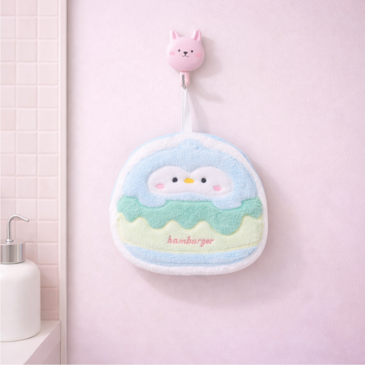 Cute penguin-shaped burger hand towel with plush fabric, kawaii hanging towel for bathroom or kitchen use.
