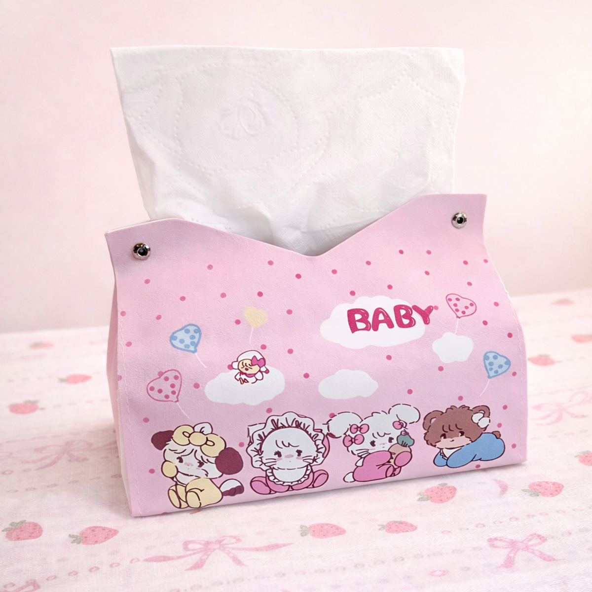 Pink pastel tissue holder with cute baby cartoon design, decorative tissue box for nursery or bedroom decor.