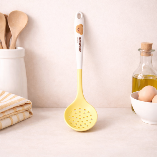 Butterbear silicone slotted spoon with cute bear handle, yellow cooking utensil for frying and draining food.