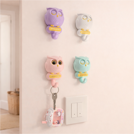 Cute owl-shaped wall hooks for keys, pastel plastic key holders for entryway and home organization.