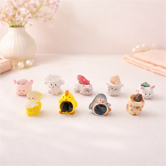 Cute mini animal figurines holding stones, kawaii desk decor collectibles for shelves and gift displays.