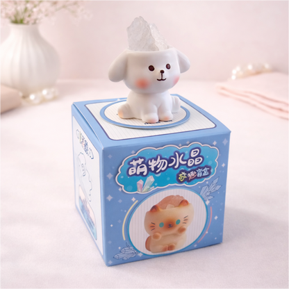 Cute dog figurine holding a stone on display box, kawaii animal collectible for desk and shelf decor.
