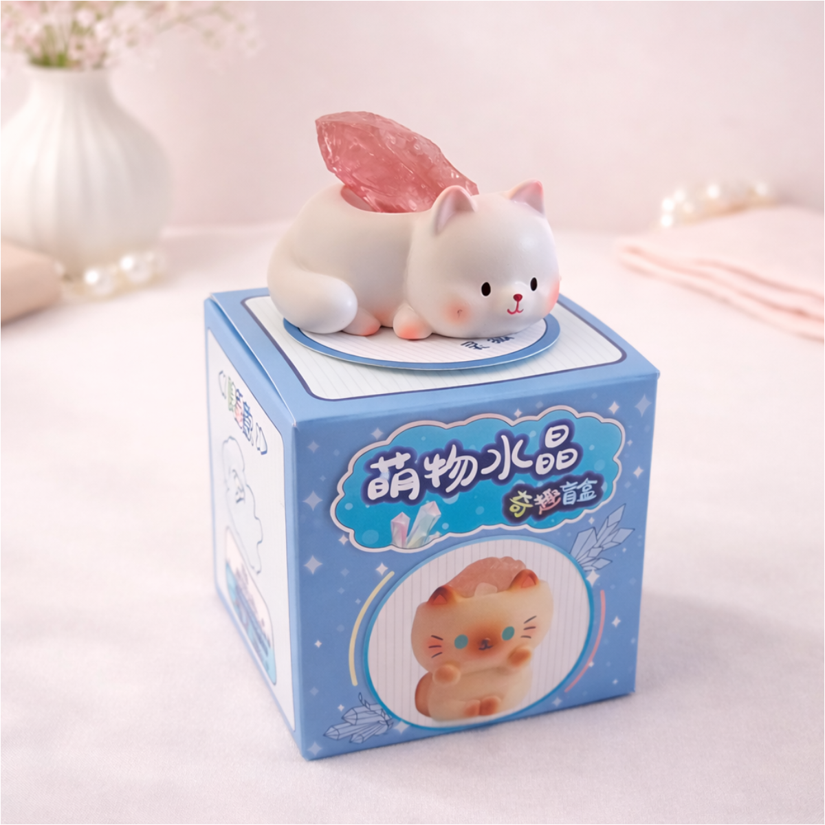 Cute fox figurine holding a crystal on display box, kawaii animal collectible for desk and shelf decor.