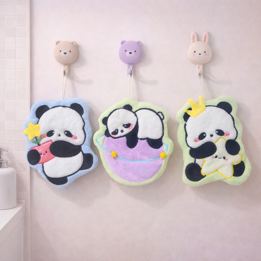 Cute panda hand towels hanging on animal wall hooks, plush kawaii bathroom towels for drying hands or face.
