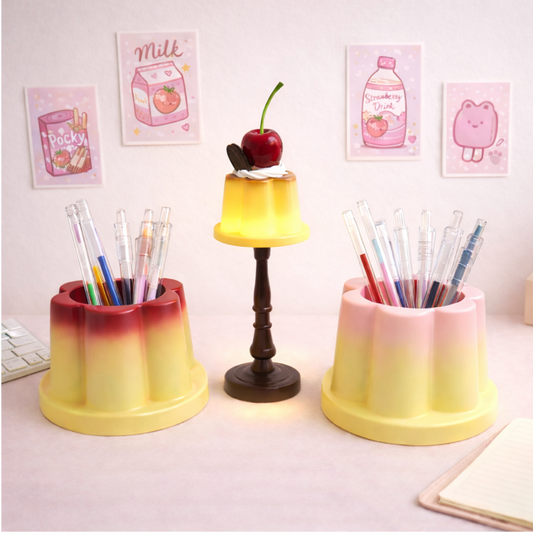 Cute pudding lamp with cherry topper and matching pudding pen holders, kawaii desk decor for stationery organization.